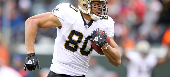 New Orleans Saints player running with football